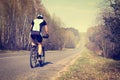 Sporty Man Riding a Bicycle on the Road Royalty Free Stock Photo