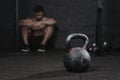 Sporty man sitting at the gym suffering breakdown to overcome. Demotivation sport concept.Stress and fatigue in sport. Crossfit k Royalty Free Stock Photo