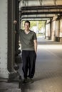 Sporty Man Standing Under a City Bridge Royalty Free Stock Photo