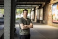 Sporty Man Standing Under a City Bridge Royalty Free Stock Photo