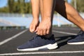 Sporty man tying shoelaces before running Royalty Free Stock Photo