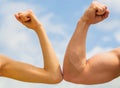 Sporty man and woman. Muscular arm vs weak hand. Vs, fight hard. Competition, strength comparison. Rivalry concept