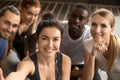 Sporty multiracial friends taking group selfie holding looking a Royalty Free Stock Photo