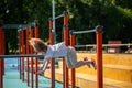 Athletic kid exercising on the sports ground