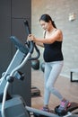 Sporty pregnant woman exercising in sports hall