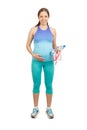 Sporty pregnant woman in the sports clothes with tape measure and a bottle of water in the hands, isolated