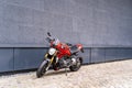 Sporty racing powerful stylish modern red motorcycle stands parked on the road