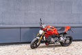 Sporty racing powerful stylish modern red motorcycle stands parked on the road