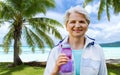 Sporty senior woman with bottle of water at park Royalty Free Stock Photo