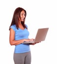 Sporty senior woman using her laptop computer