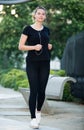 Girl jogging outdoor with music