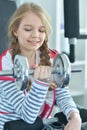 Teen girl exercising with dumbbell Royalty Free Stock Photo