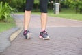 Sporty woman ankle sprain while jogging or running at park Royalty Free Stock Photo