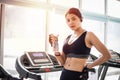 Sporty woman asia drinking water after exercises in the gym. Fitness - concept of healthy Royalty Free Stock Photo