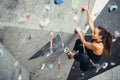 Sporty woman in boulder climbing hall Royalty Free Stock Photo