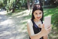 Sporty woman choosing music at outdoor workout