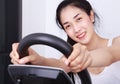 Sporty woman doing exercises with elliptical trainer Royalty Free Stock Photo