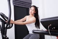 Sporty woman doing exercises with elliptical trainer Royalty Free Stock Photo