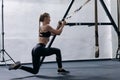 Sporty woman doing TRX exercises in the gym Royalty Free Stock Photo