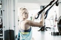 Sporty woman doing TRX exercises in the gym - Image Royalty Free Stock Photo