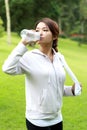 Sporty woman drinking mineral water Royalty Free Stock Photo