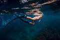 Sporty woman with fins swim in blue ocean Royalty Free Stock Photo