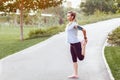 Sporty woman jogging in empty park due to social distancing measures