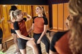 Sporty woman in locker room.Happy girls after training Royalty Free Stock Photo