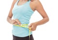 Sporty woman measures her waist with measuring tape Royalty Free Stock Photo