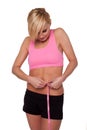 Sporty woman measuring her waist Royalty Free Stock Photo