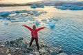 Sporty woman near Ice Glacier Jokulsarlon Lagoon, Iceland Royalty Free Stock Photo