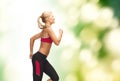 Sporty woman running or jumping Royalty Free Stock Photo