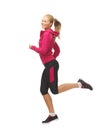 Sporty woman running or jumping Royalty Free Stock Photo