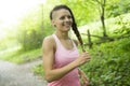 Sporty woman running outdoors in park Royalty Free Stock Photo