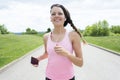 Sporty woman running outdoors in park Royalty Free Stock Photo