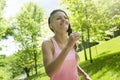 Sporty woman running outdoors in park Royalty Free Stock Photo