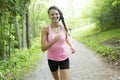 Sporty woman running outdoors in park Royalty Free Stock Photo