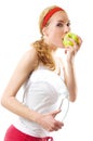 Sporty woman with scale and green apple Royalty Free Stock Photo