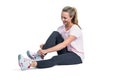 Sporty woman smiling while tying shoelace Royalty Free Stock Photo