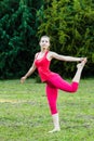 Sporty woman stretching outdoors