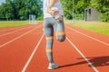 Sporty woman stretching on running track Royalty Free Stock Photo