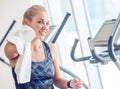 Sporty woman with towel in gym after training Royalty Free Stock Photo