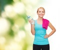 Sporty woman with towel and watel bottle Royalty Free Stock Photo