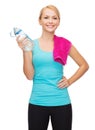 Sporty woman with towel and watel bottle Royalty Free Stock Photo