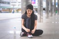 Sporty woman tying her shoes ready for city jogging Royalty Free Stock Photo