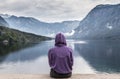 Sporty woman watching tranquil overcast morning scene at lake Bohinj, Alps mountains, Slovenia. Royalty Free Stock Photo