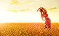 Sporty woman in wheat field Royalty Free Stock Photo