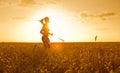 Sporty woman in wheat field Royalty Free Stock Photo