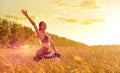 Sporty woman in wheat field Royalty Free Stock Photo