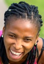 Sporty young African woman laughing at the camera